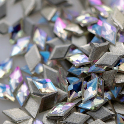 Paradise Shine diamond-shaped flatback zircon stones in a compact 3.5×2mm size, with iridescent colour shifts and flat backs for nail-art application.