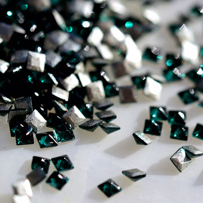 Flatback Zircon Nail Art Square Emerald crystals measuring 1.5mm with deep green, emerald and jewel-toned reflections.
