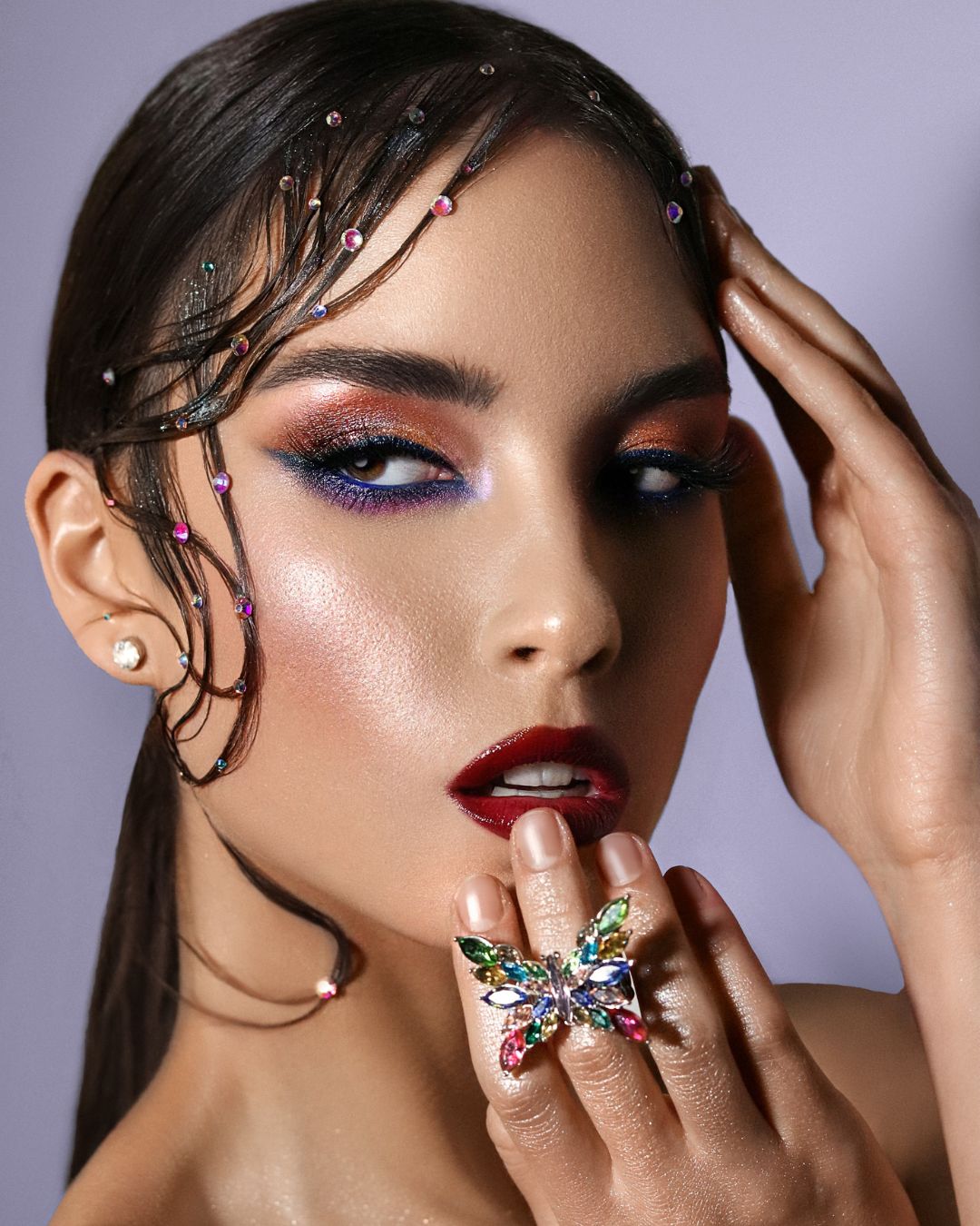 Model wearing sparkling hair crystals and a bold crystal ring, illustrating creative ways to use Eunails rhinestones for hair decoration and accessories