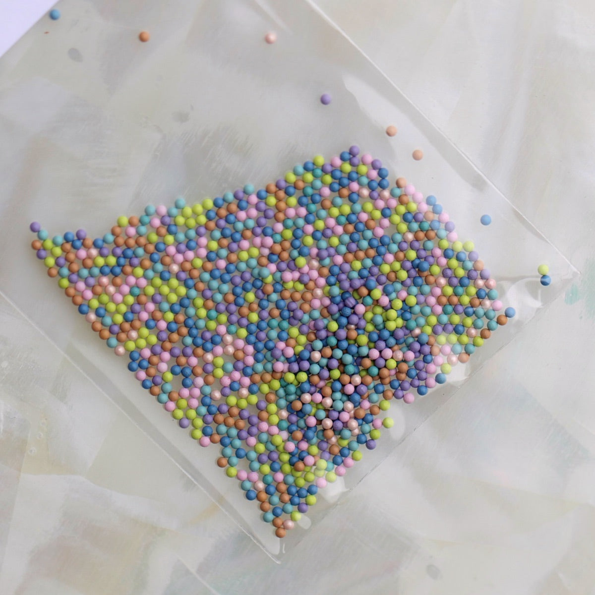 1mm Candy Blue Pastel Mix metallic nail caviar beads in blue, aqua, lilac, pink, lime green and peach colours for nail art.