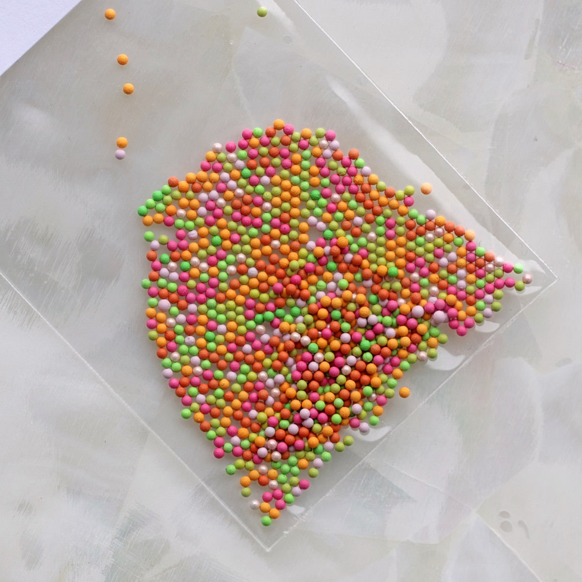 1mm Candy Orange Pastel Mix metallic nail caviar beads in orange, coral, lime green, pink, peach and lavender colours for nail art.