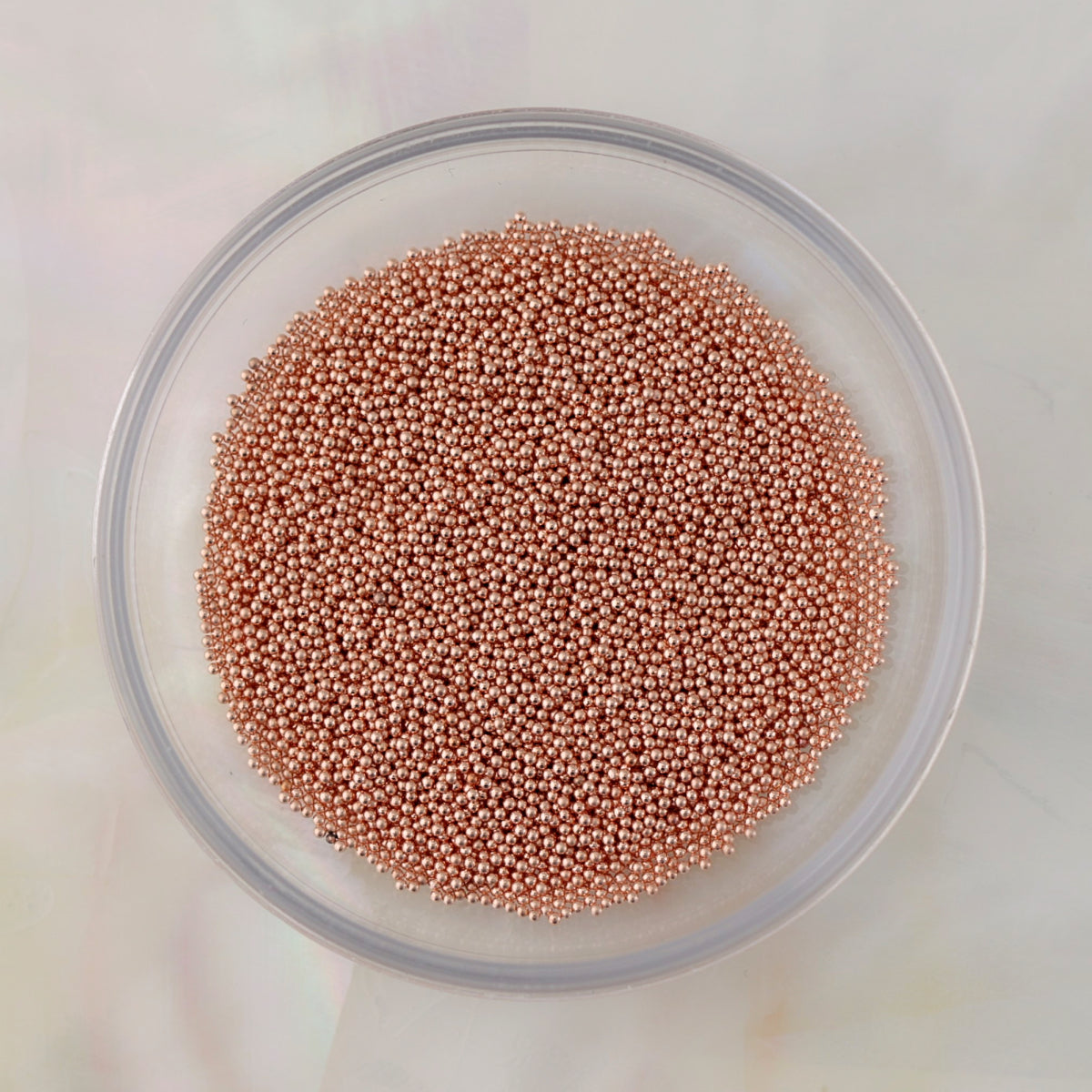 Rose gold metallic caviar beads in 0.4mm, 0.6mm and 0.8mm sizes, suitable for crystal outlines, textured accents and 3D nail designs.