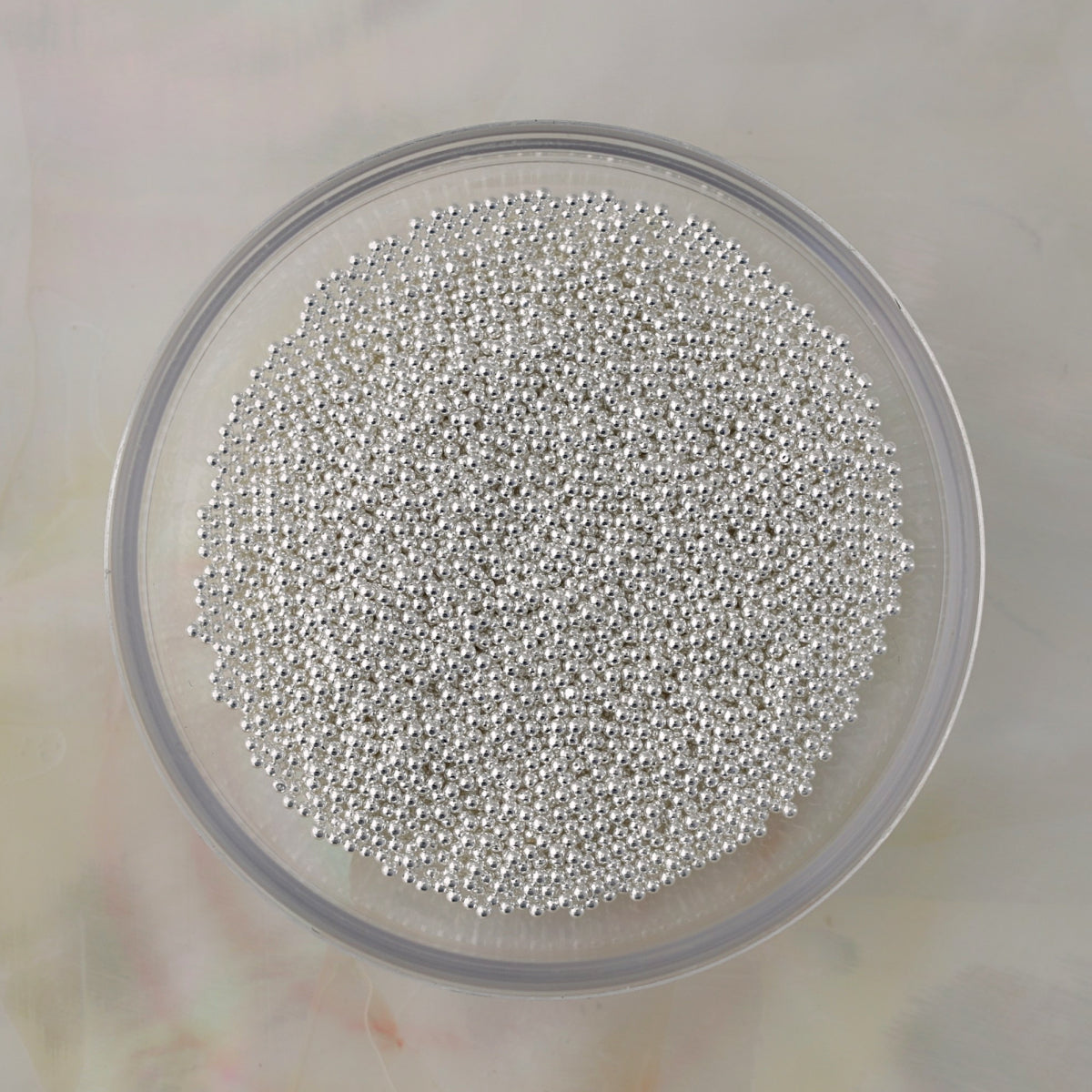 Silver metal caviar beads in multiple sizes for textured nail art, crystal borders and 3D nail designs.